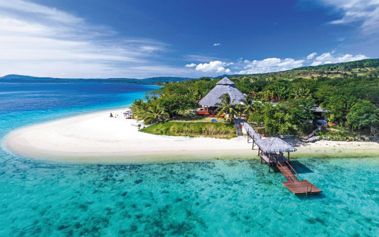 Tropical beach resort on a private island in Vanuatu, South Pacific, offering a serene island escape outside the Caribbean.