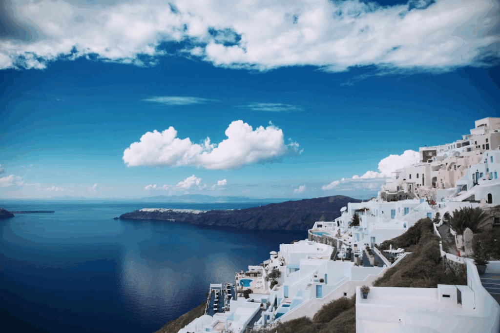 Whitewashed buildings overlooking the Aegean Sea in Santorini during shoulder season travel in Greece