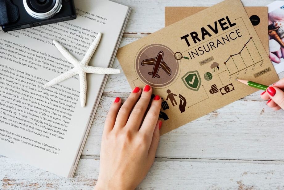 Woman reviewing travel insurance brochure with icons showing trip protection and coverage benefits