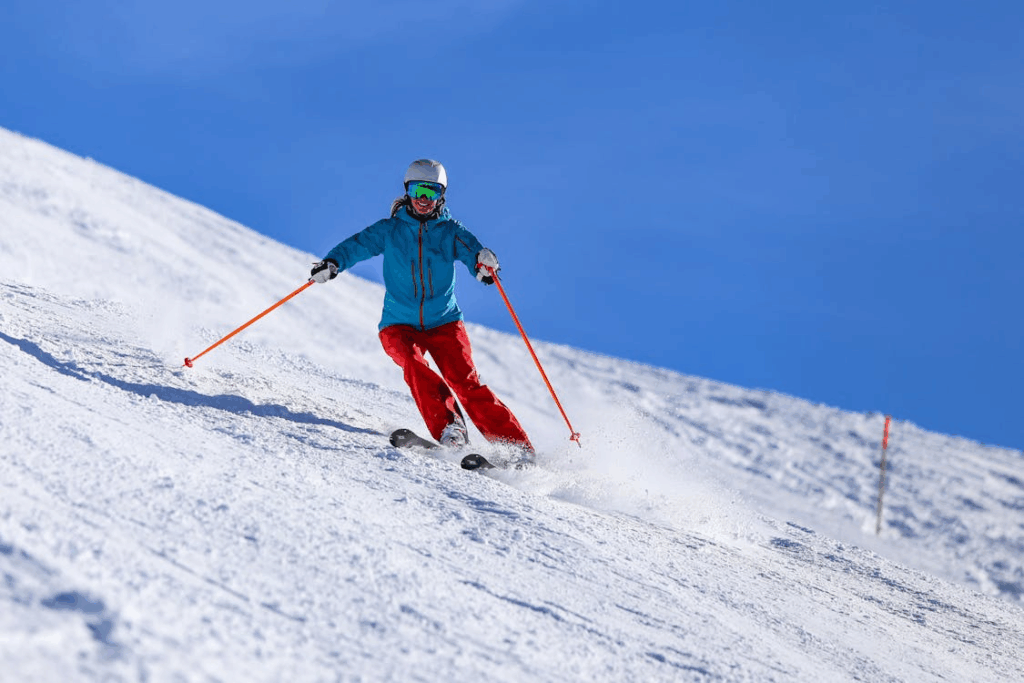 Spring skiing during shoulder season with clear skies and soft snow