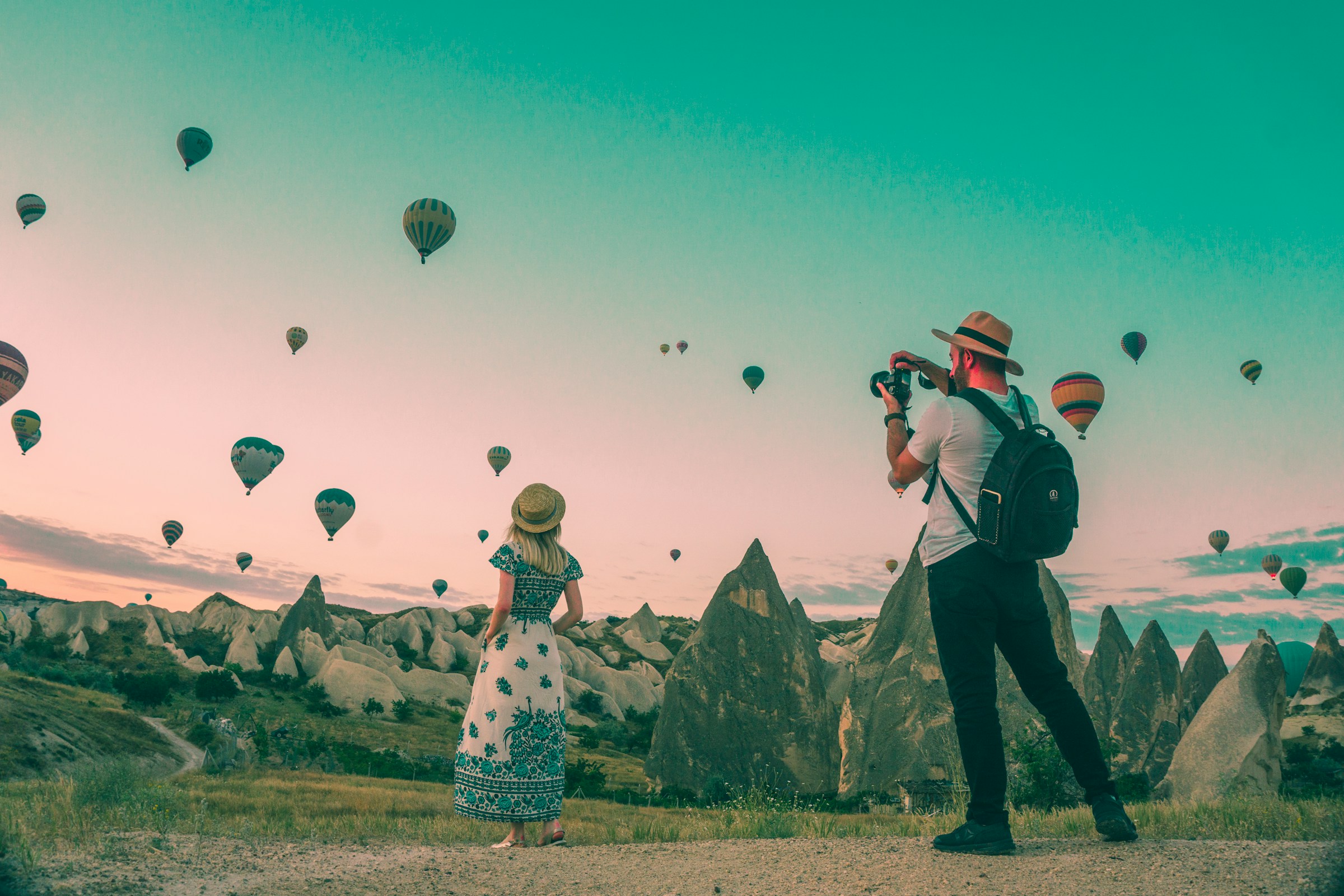 man taking photo of hot air balloon, Unsplash