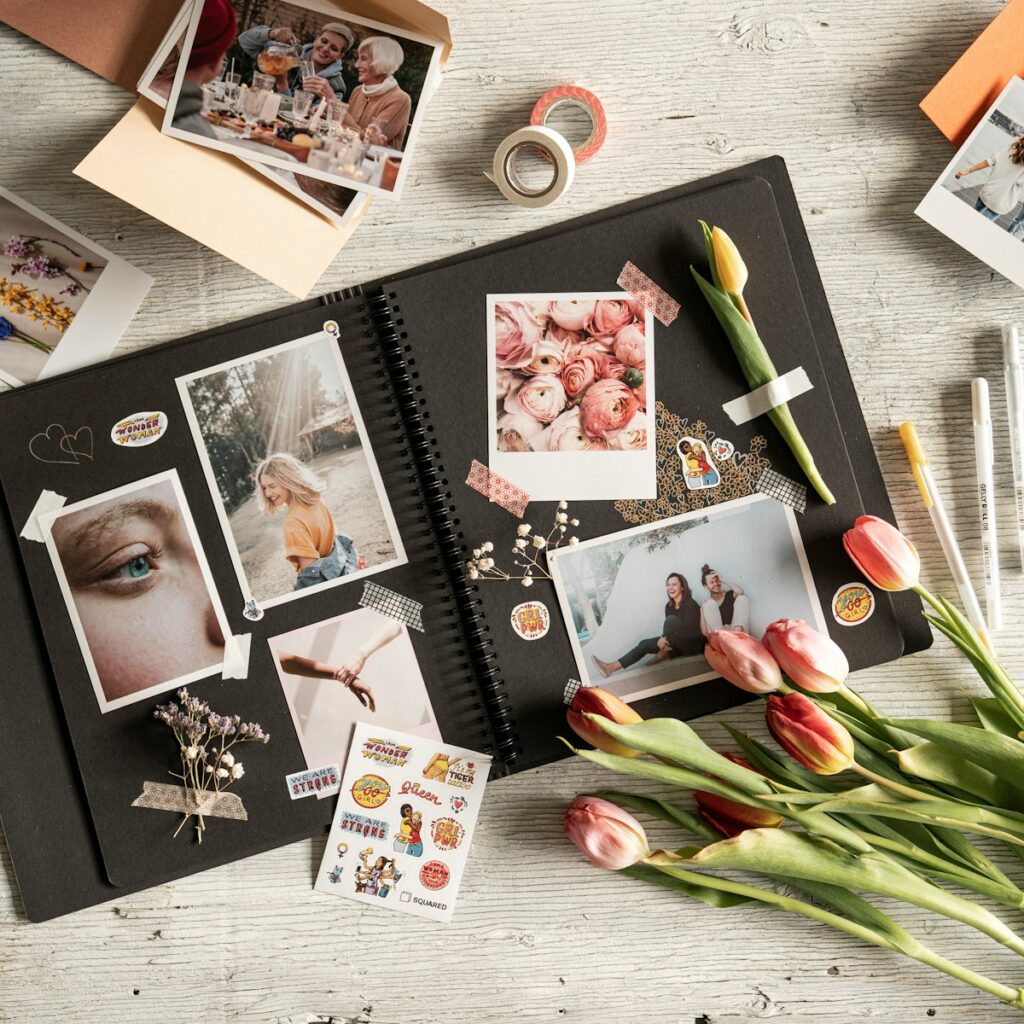 a table with a bunch of pictures and flowers on it