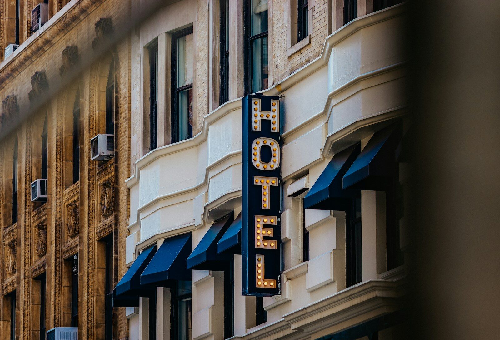 A hotel sign on the side of a building