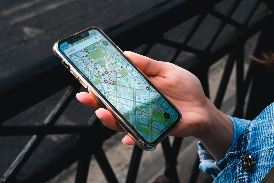 Phone map showing one of the best travel apps for navigating a new city.