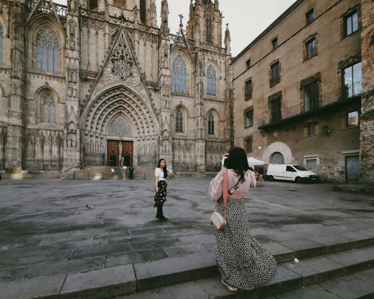 Traveler standing near Gothic architecture in one of the best cities for architecture lovers.